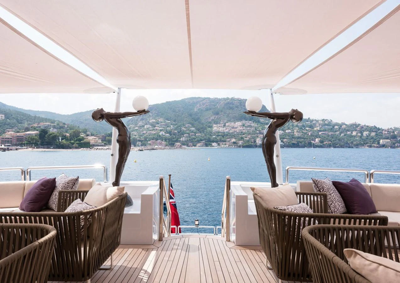 a large sculpture of a couple of birds on a roof aboard LADY A Yacht for Sale