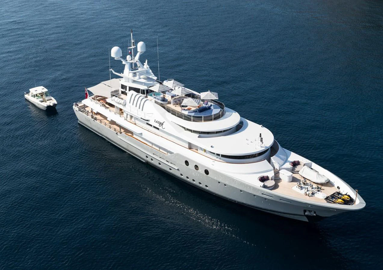a large white ship in the water aboard LADY A Yacht for Sale