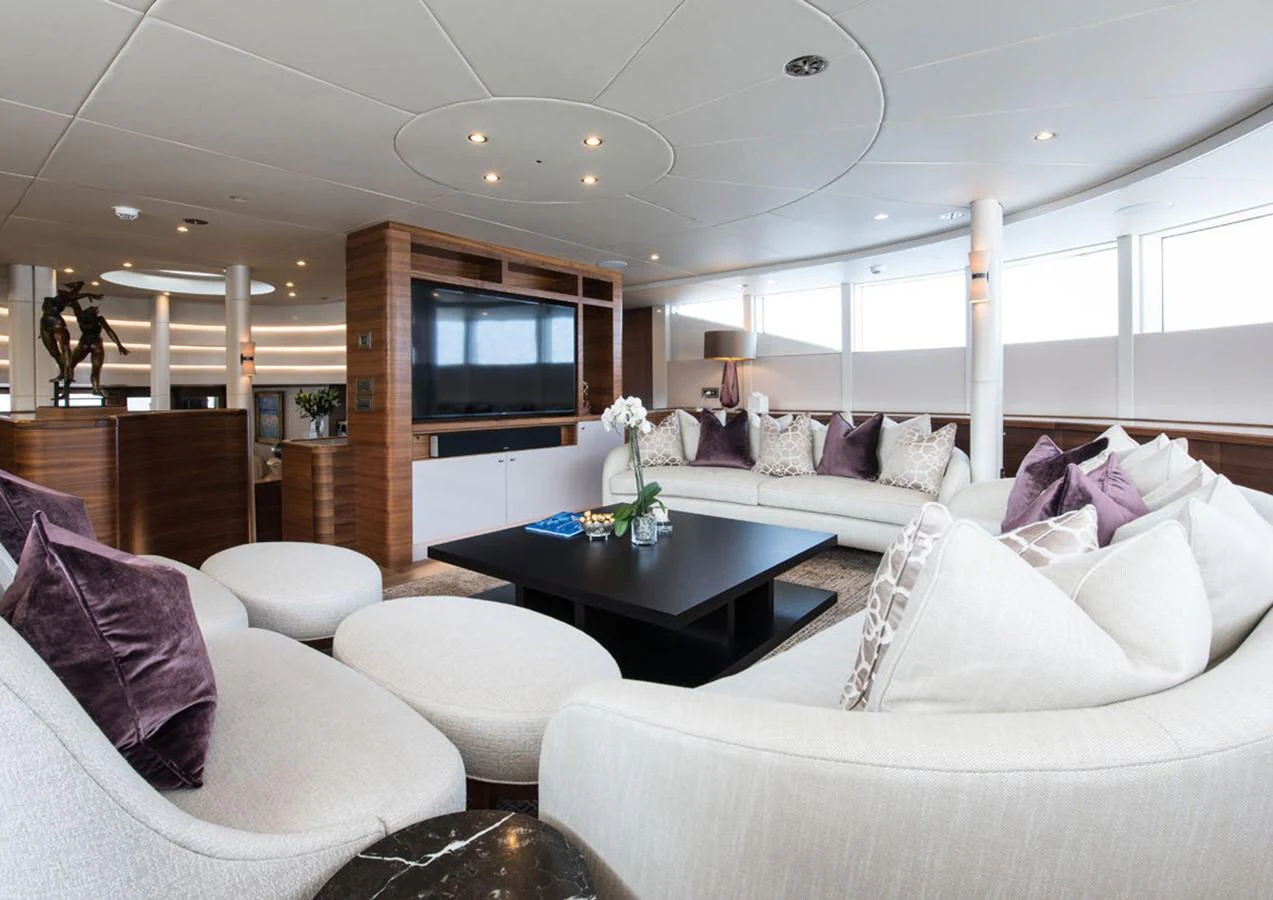 a living room with a large window aboard LADY A Yacht for Sale