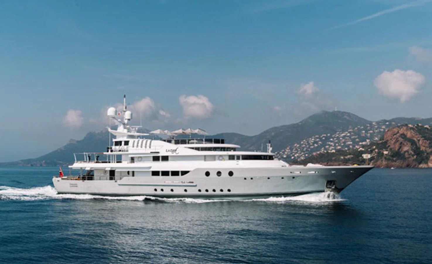a white boat on the water aboard LADY A Yacht for Sale
