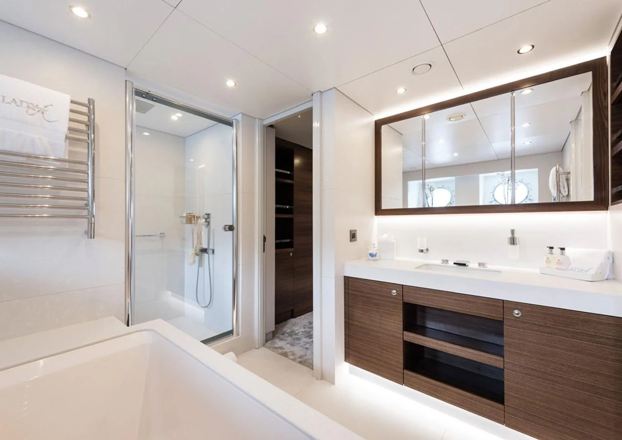 a bathroom with a large mirror aboard LADY A Yacht for Sale