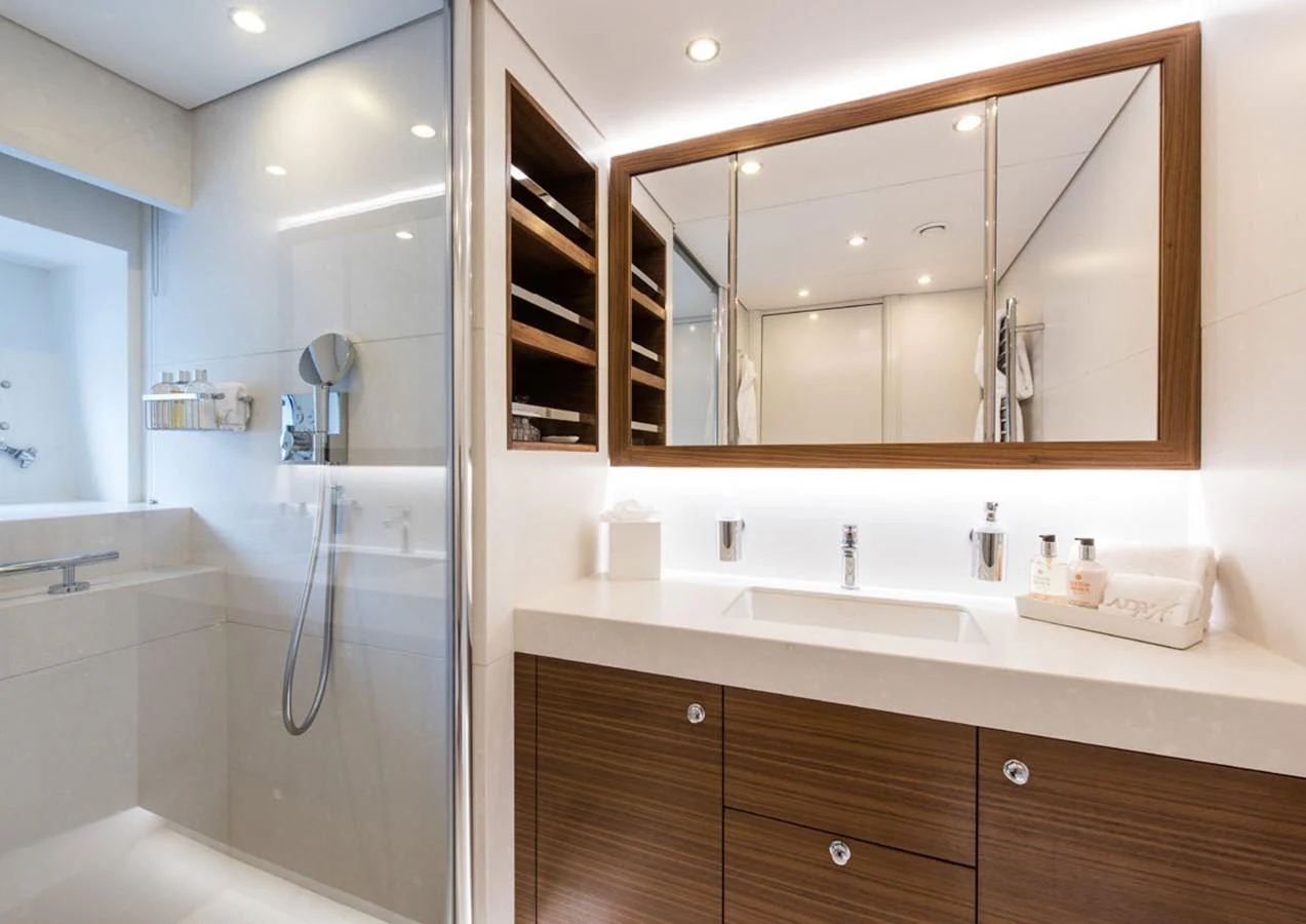 a bathroom with a large mirror aboard LADY A Yacht for Sale