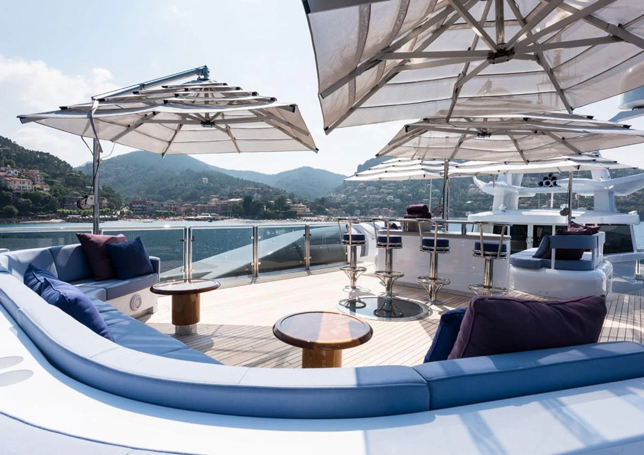 a large white boat on a large body of water aboard LADY A Yacht for Sale