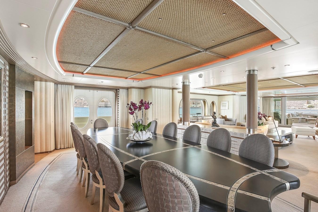a large dining table with chairs aboard SAMIRA Yacht for Sale