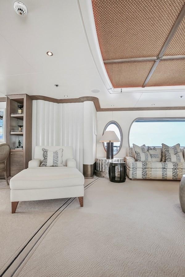 a room with a bed and a window aboard SAMIRA Yacht for Sale