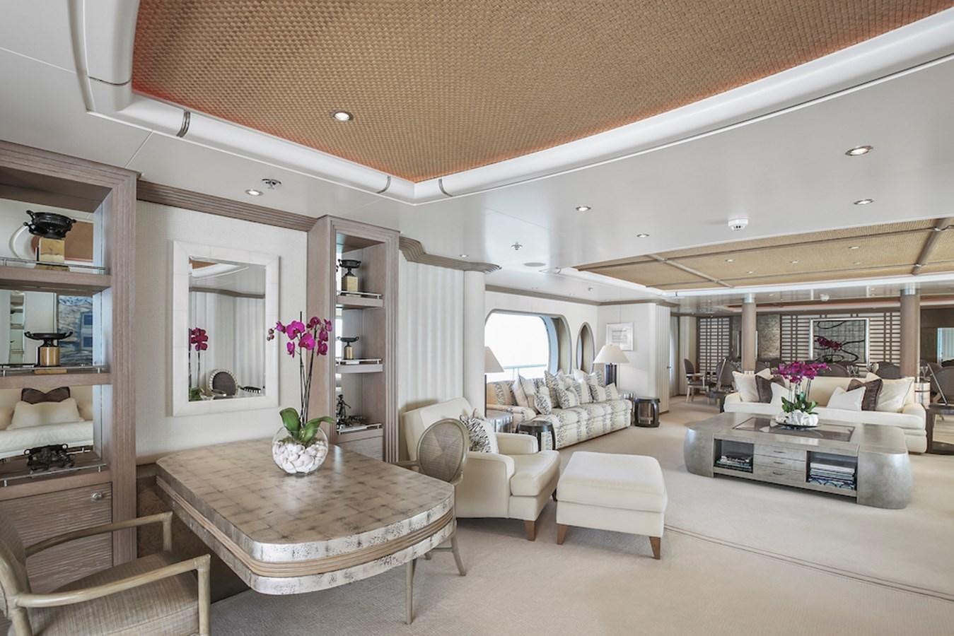 a living room with a table and chairs aboard SAMIRA Yacht for Sale