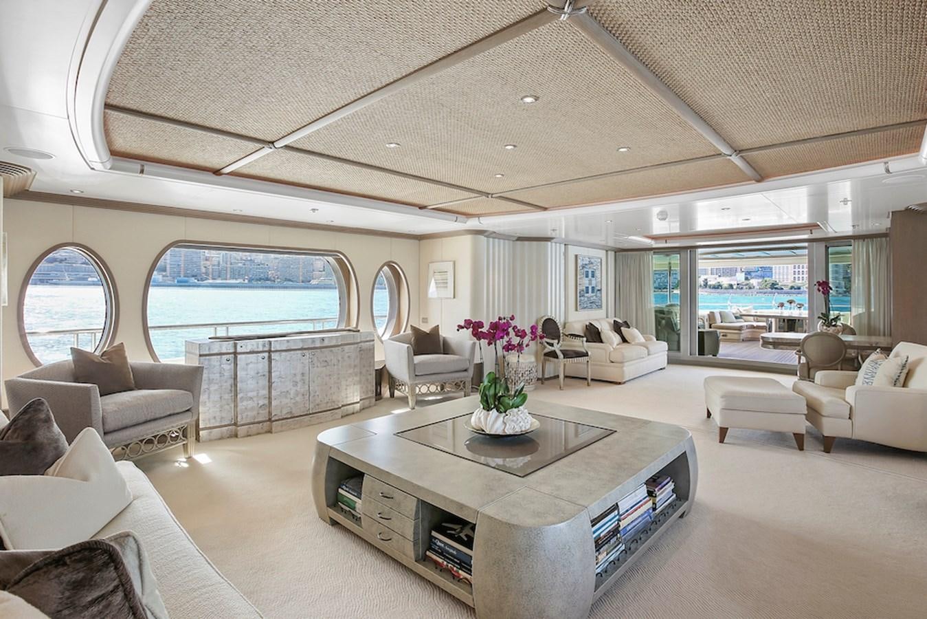 a living room with a large window aboard SAMIRA Yacht for Sale