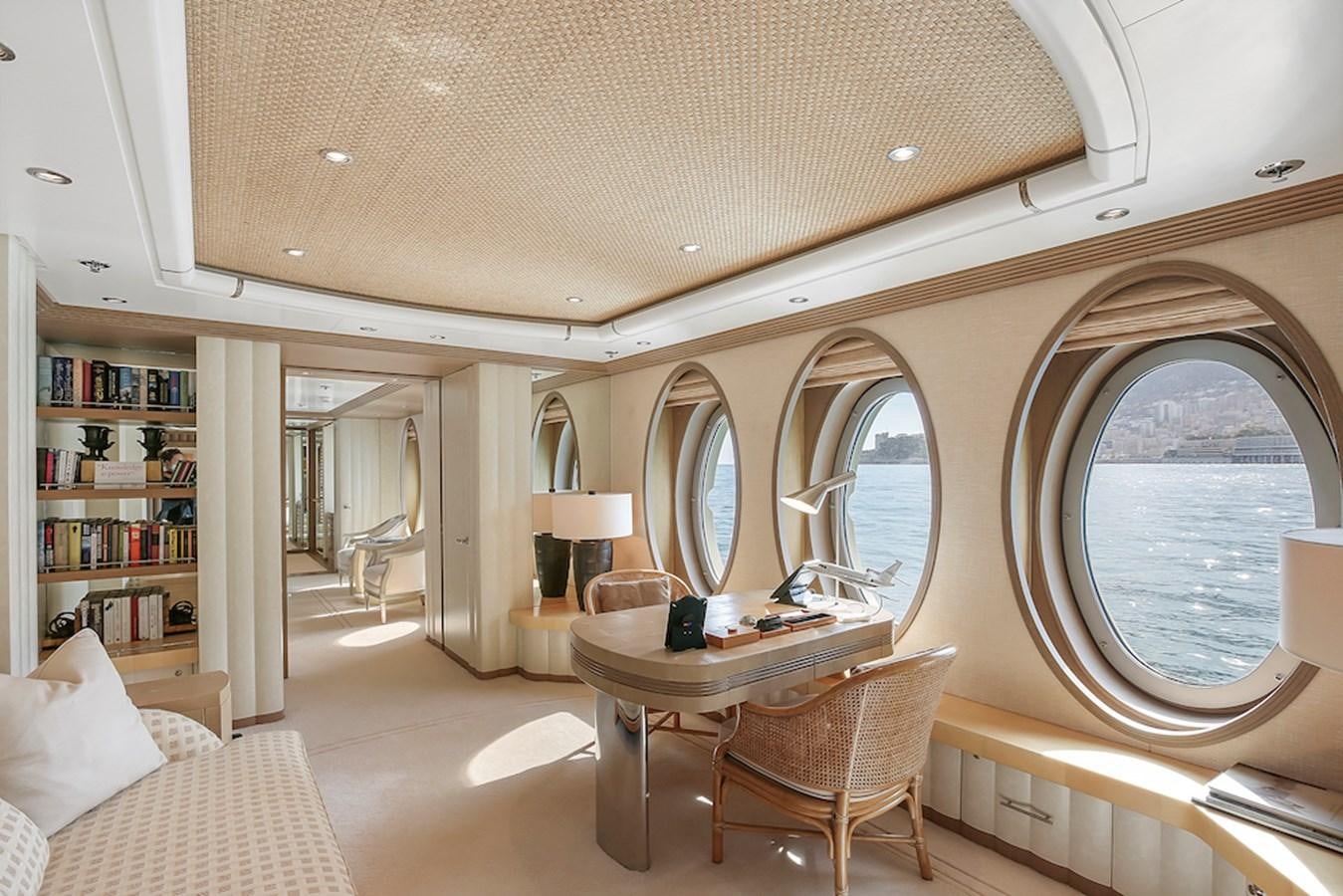 a large room with a table and chairs aboard SAMIRA Yacht for Sale