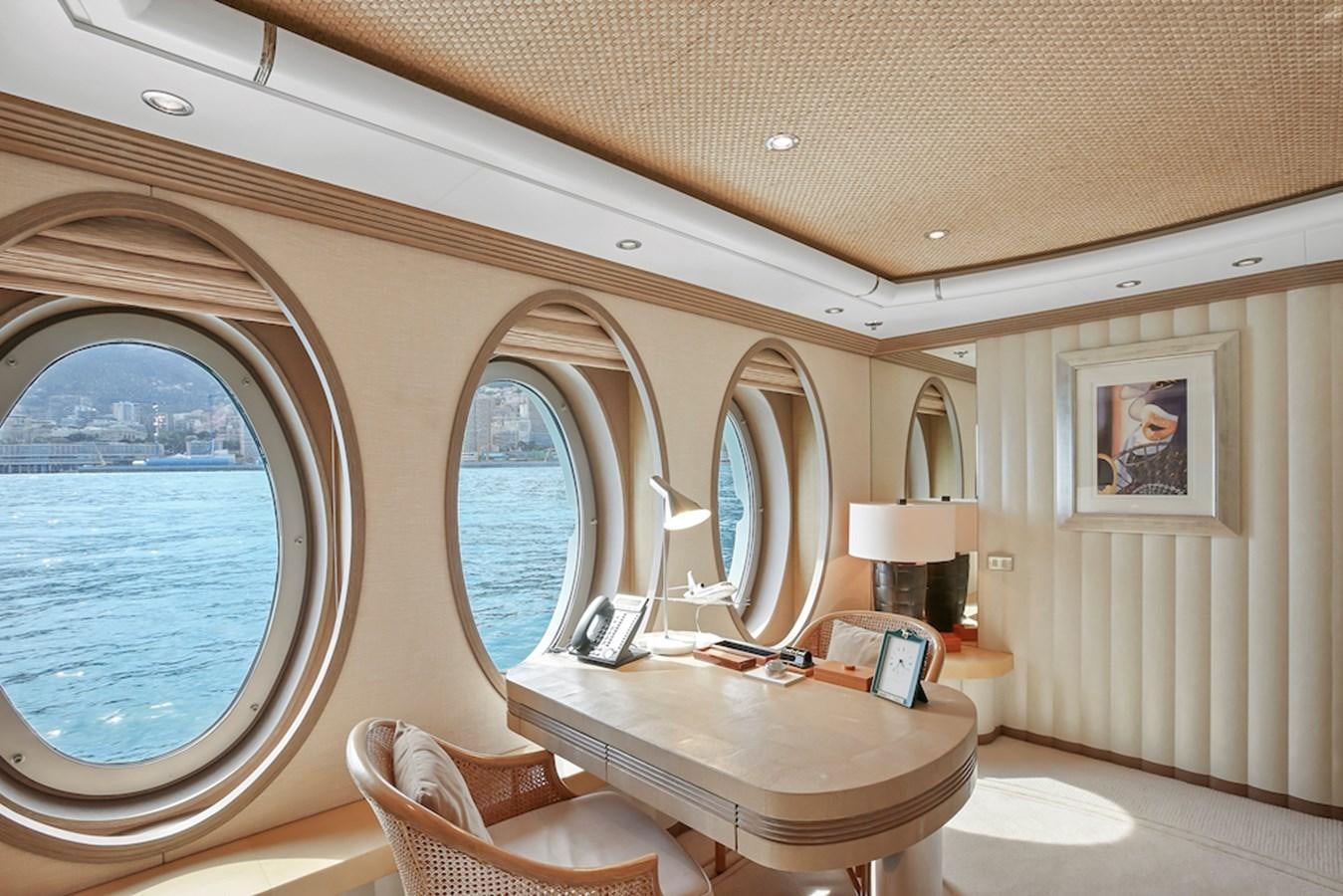 a room with a round mirror aboard SAMIRA Yacht for Sale