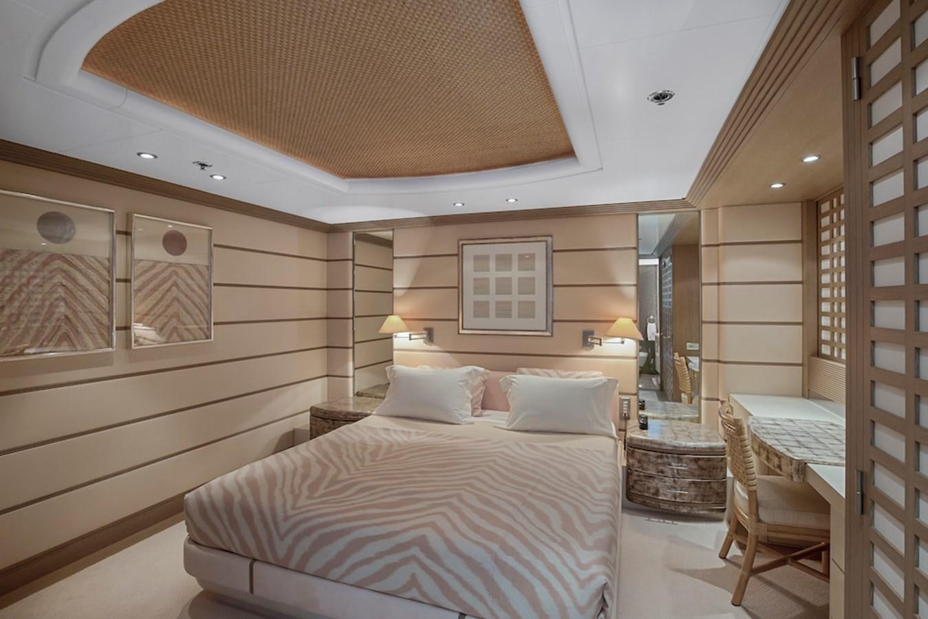 a room with a bed and a mirror aboard SAMIRA Yacht for Sale