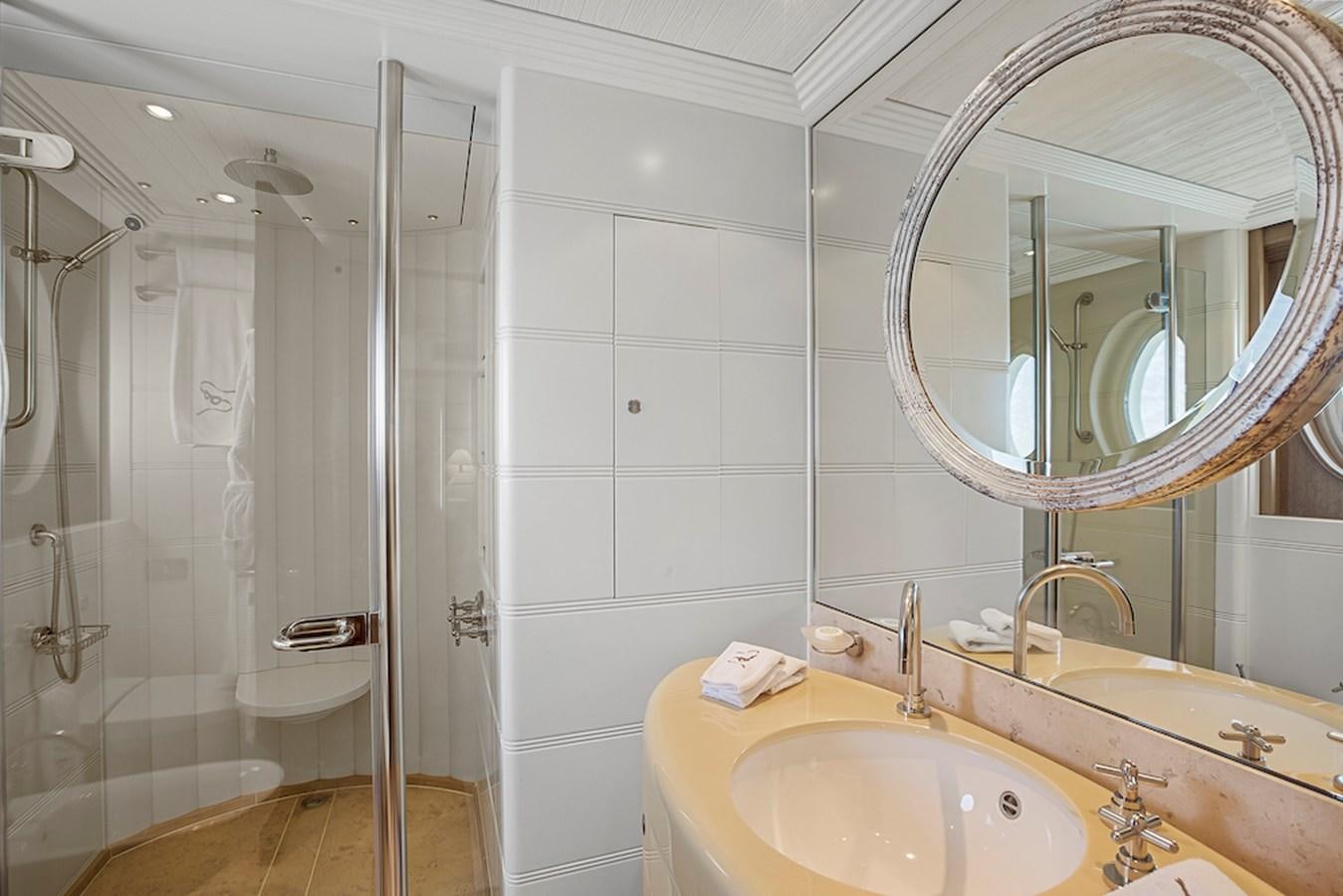 a bathroom with a glass shower aboard SAMIRA Yacht for Sale