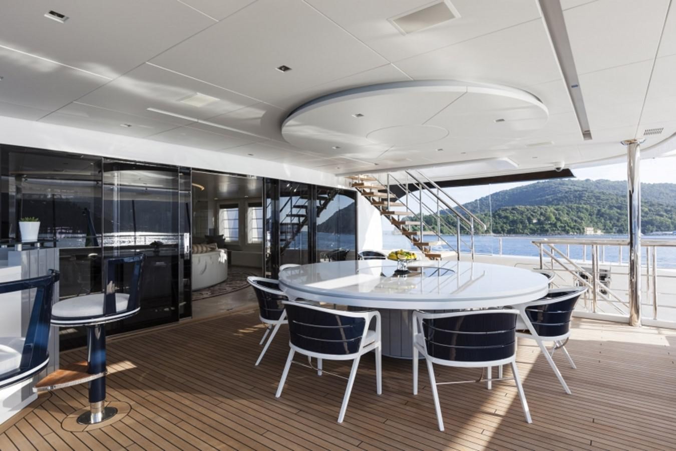 a room with a table and chairs aboard QUINTA ESSENTIA Yacht for Sale