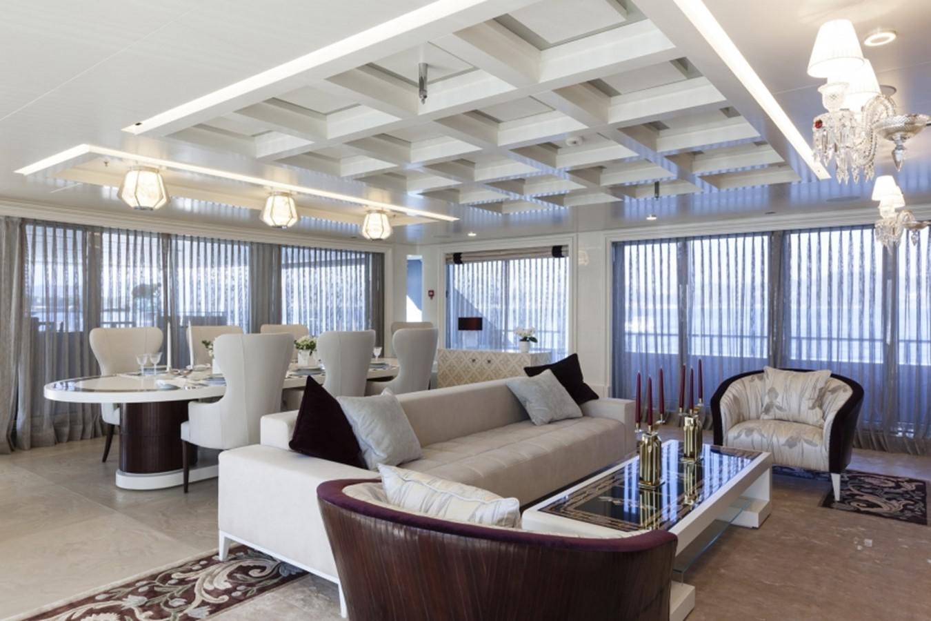 a living room with a large window aboard QUINTA ESSENTIA Yacht for Sale