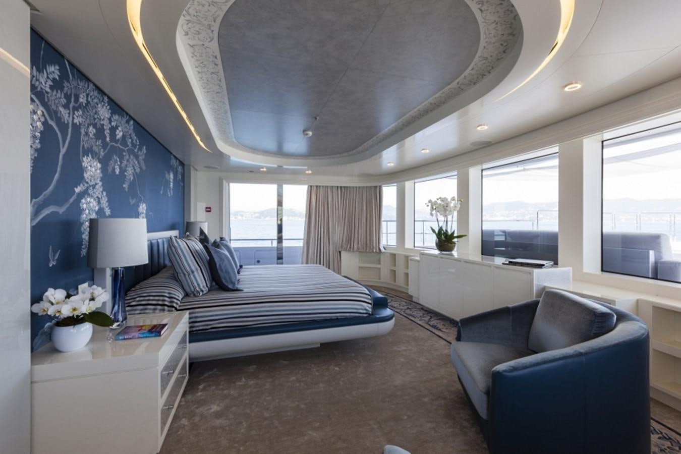 a bedroom with a bed and a couch aboard QUINTA ESSENTIA Yacht for Sale