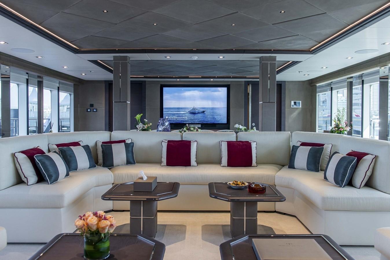 a living room with a large screen aboard MAJESTY 175 Yacht for Sale