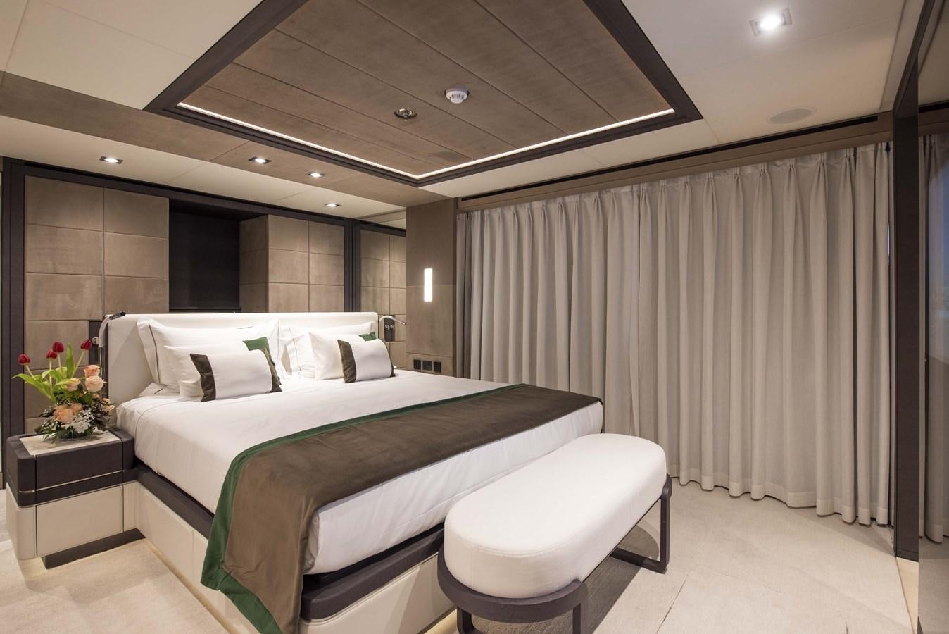 a room with a bed and a desk aboard MAJESTY 175 Yacht for Sale