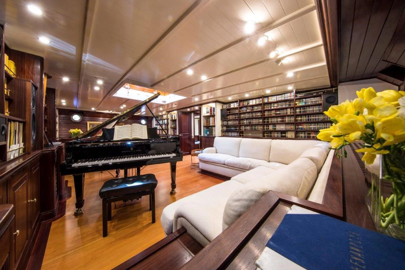 a piano in a room aboard SHENANDOAH OF SARK Yacht for Charter