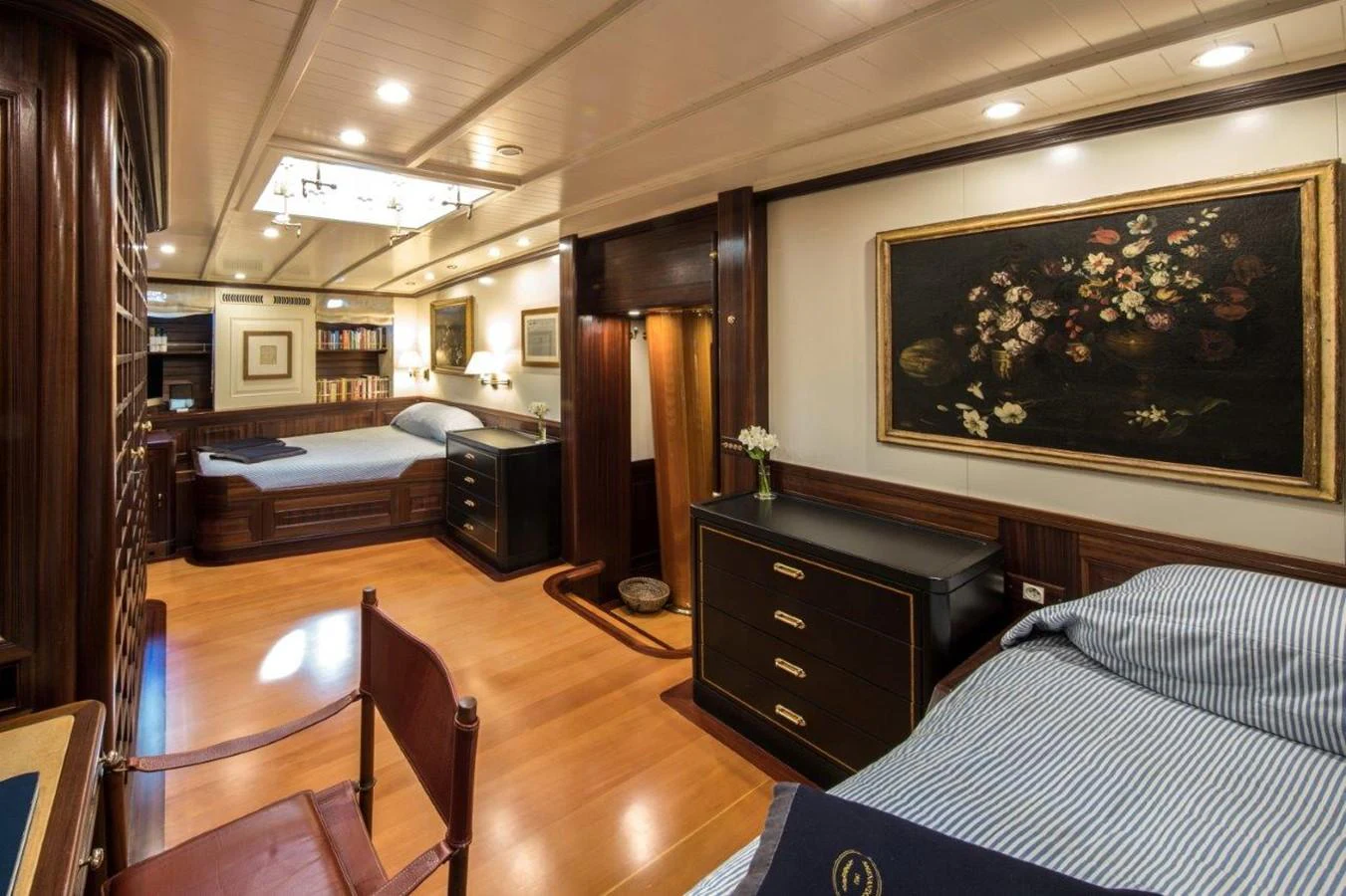 a bedroom with a large bed aboard SHENANDOAH OF SARK Yacht for Charter