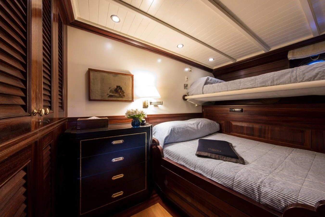 a room with a bed and a laptop on the bed aboard SHENANDOAH OF SARK Yacht for Charter