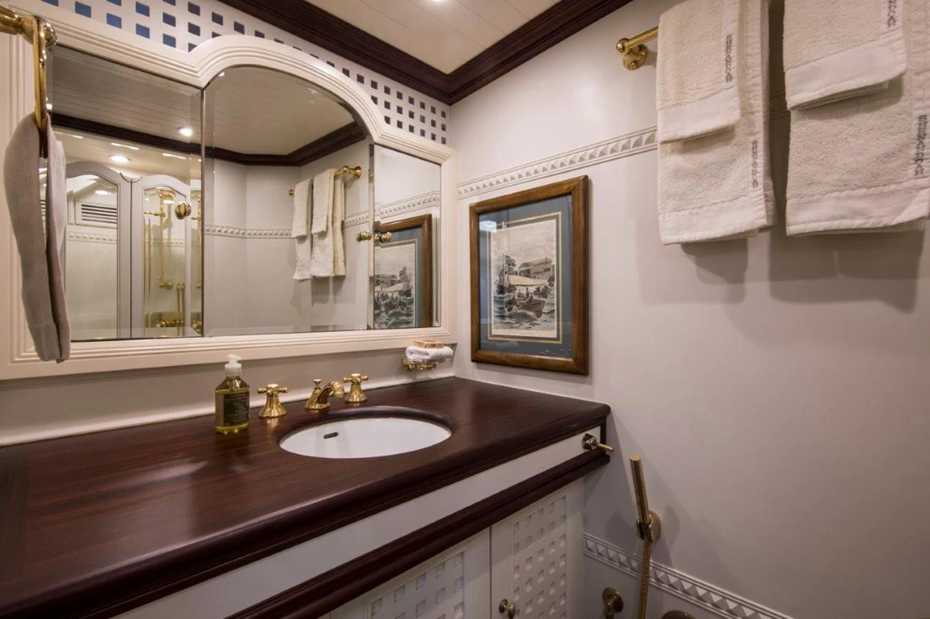 a bathroom with a large mirror aboard SHENANDOAH OF SARK Yacht for Charter