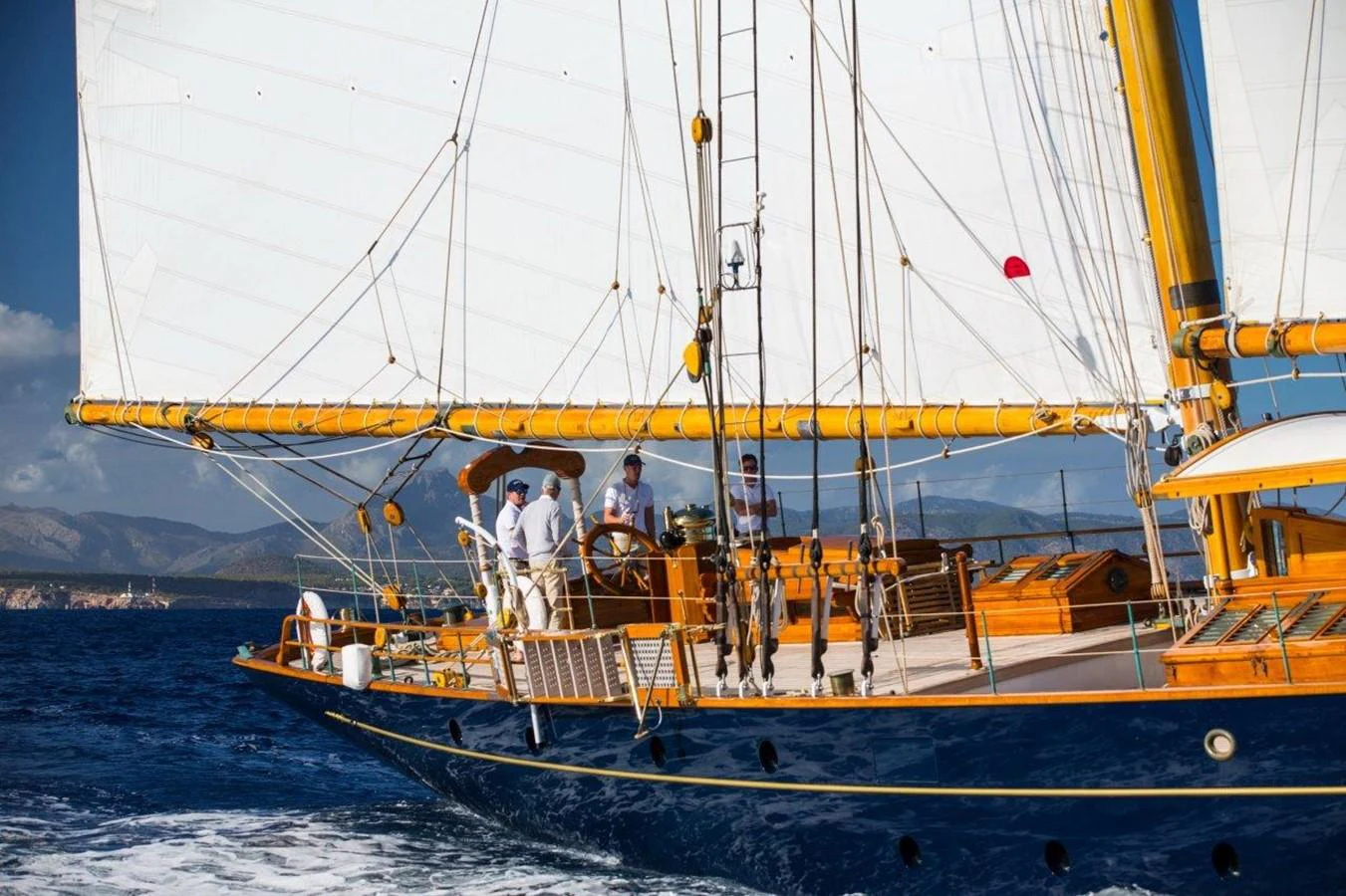 a group of people on a sailboat aboard SHENANDOAH OF SARK Yacht for Charter