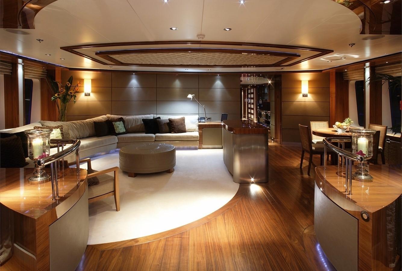 a living room with a large sofa aboard TALISMAN MAITON Yacht for Sale