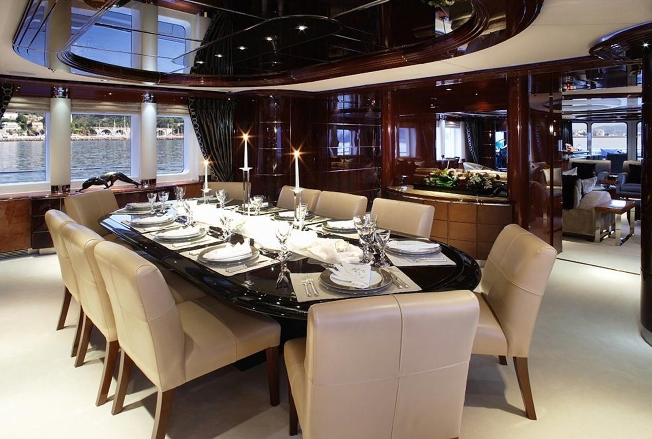 a dining room with a large table aboard TALISMAN MAITON Yacht for Charter