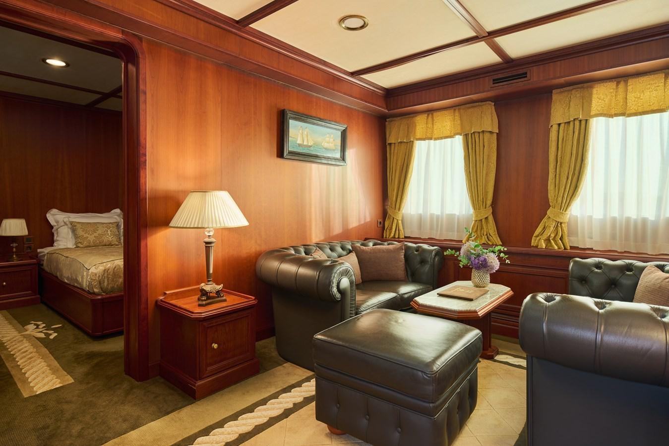 a living room with a couch and a coffee table aboard SEAGULL II Yacht for Sale