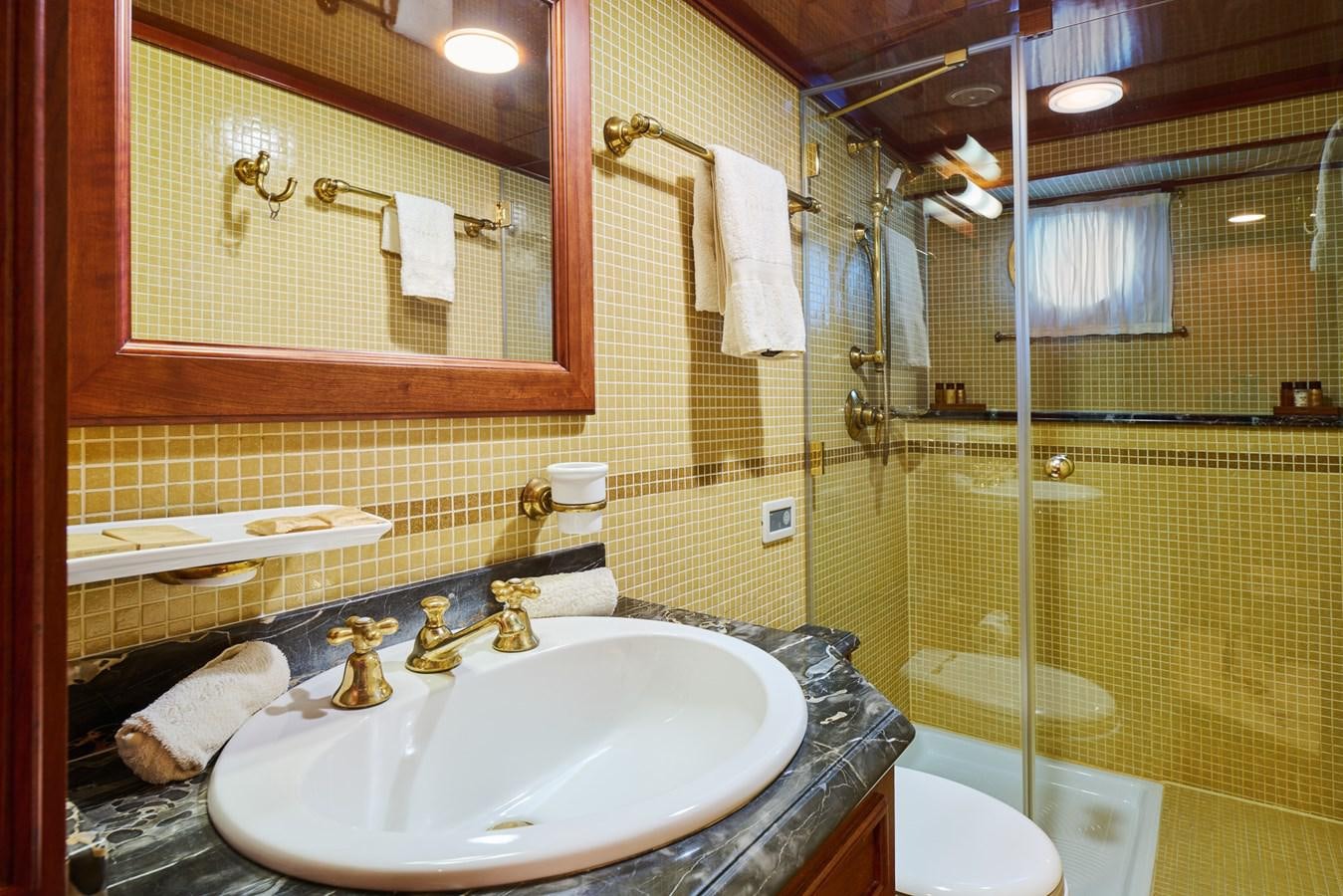 a bathroom with a large mirror aboard SEAGULL II Yacht for Sale