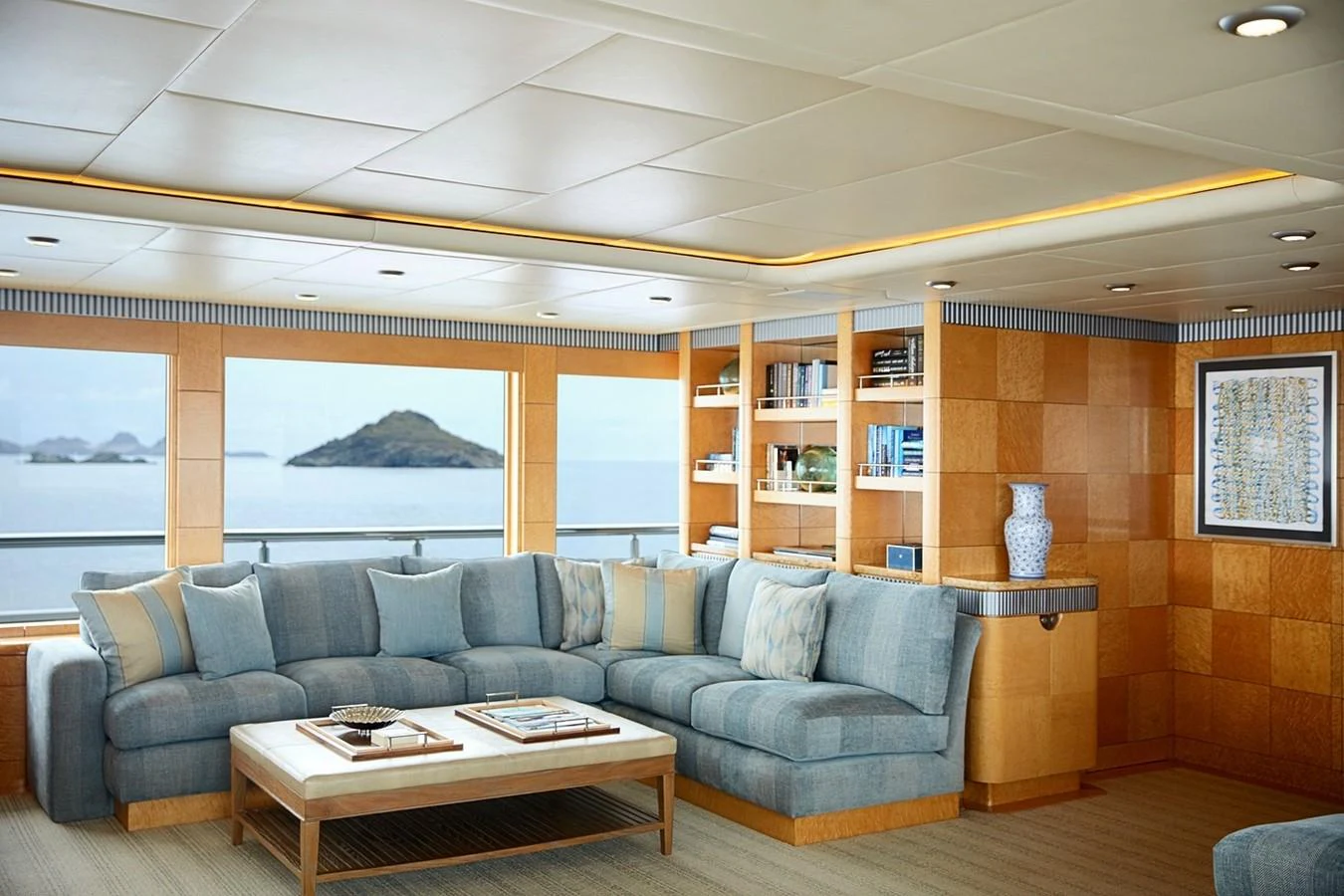 a living room with a large window aboard FORTUNATE SUN Yacht for Sale