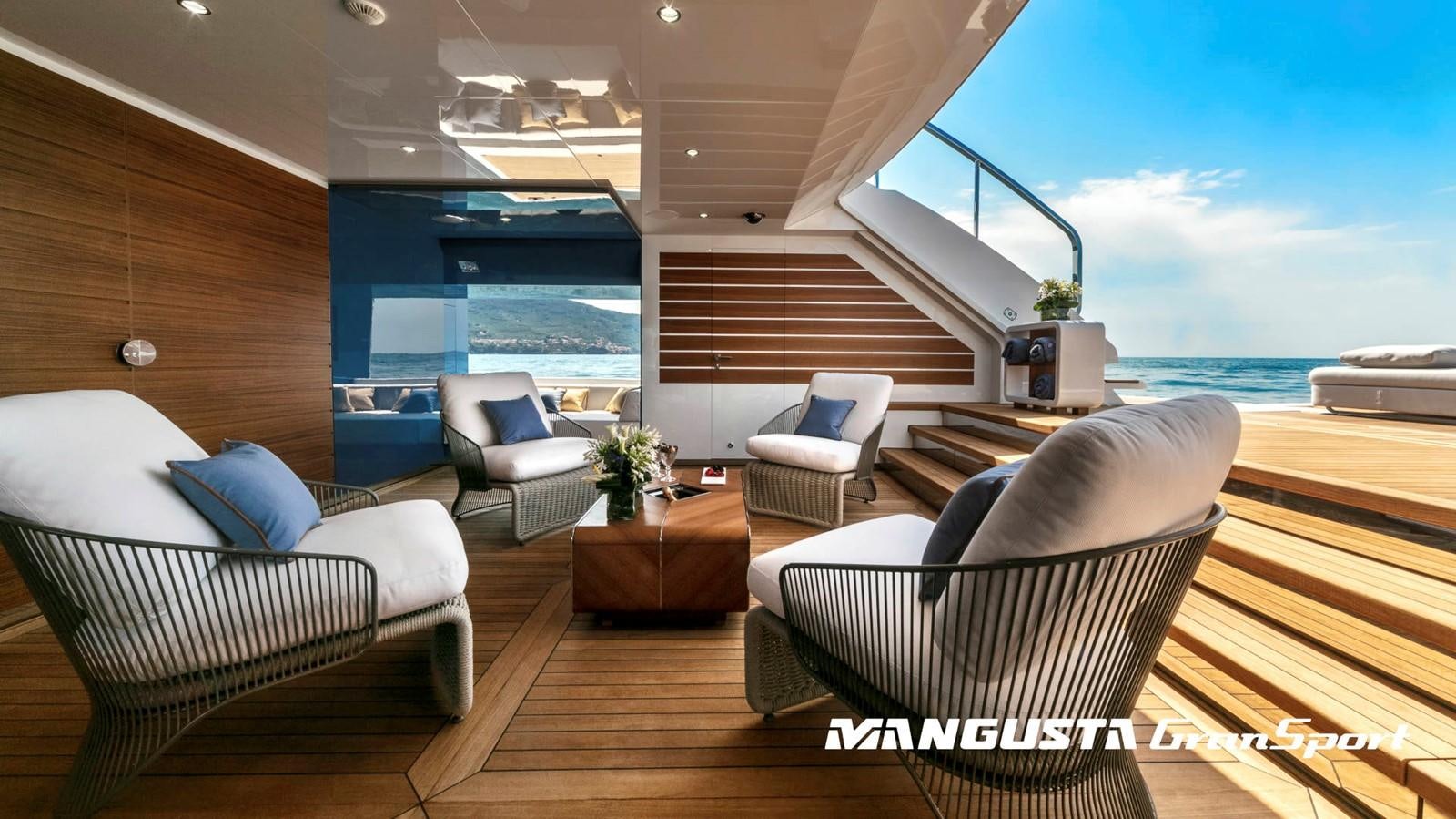 a room with a view of the ocean and the deck aboard MANGUSTA 165REV/04 Yacht for Sale