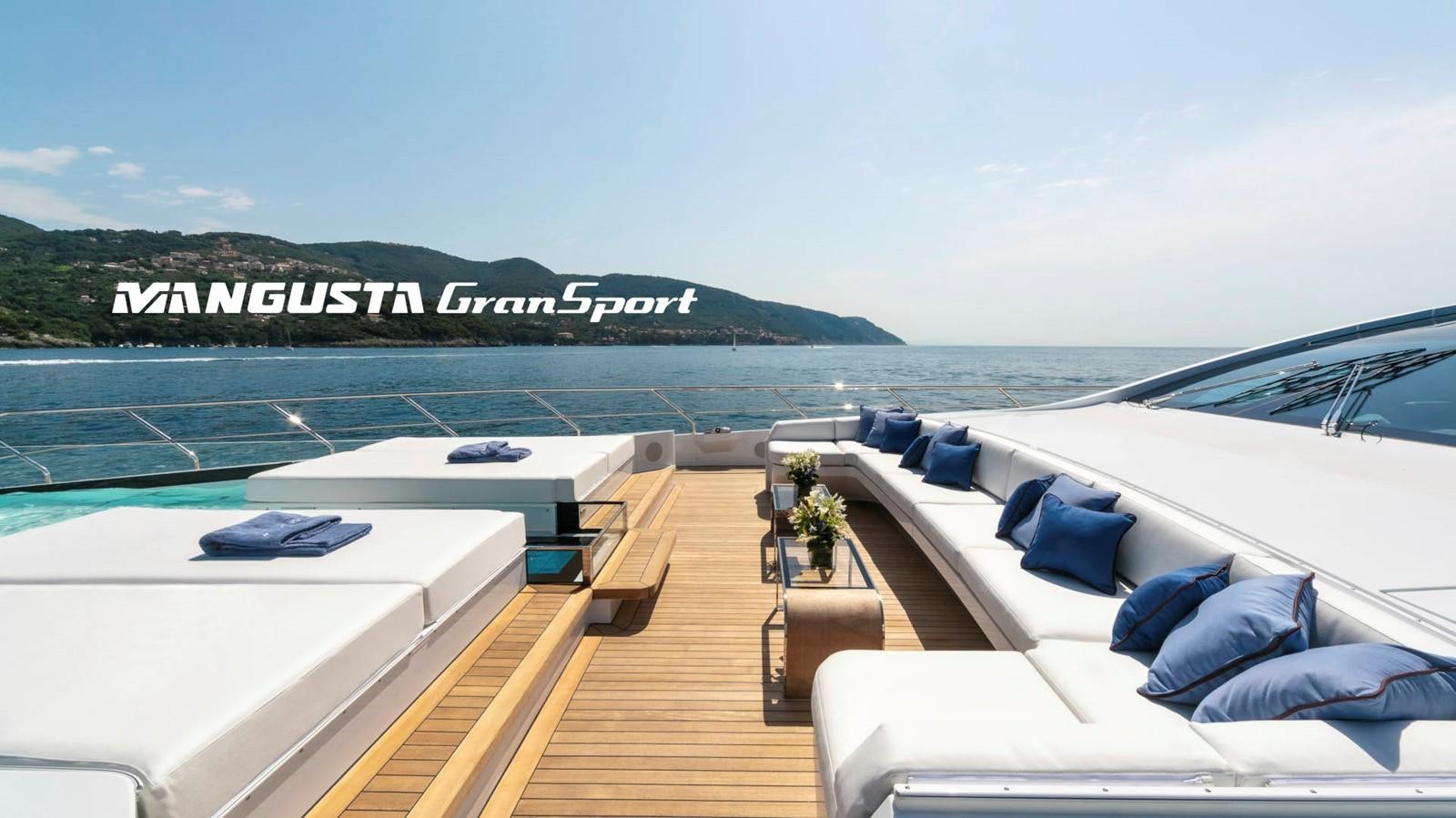 a deck with a large body of water and a large ship in the background aboard MANGUSTA 165REV/04 Yacht for Sale