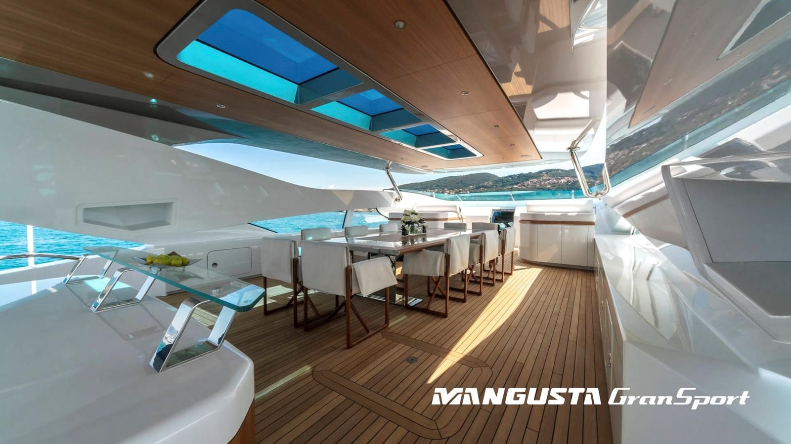 a room with a table and chairs aboard MANGUSTA 165REV/04 Yacht for Sale
