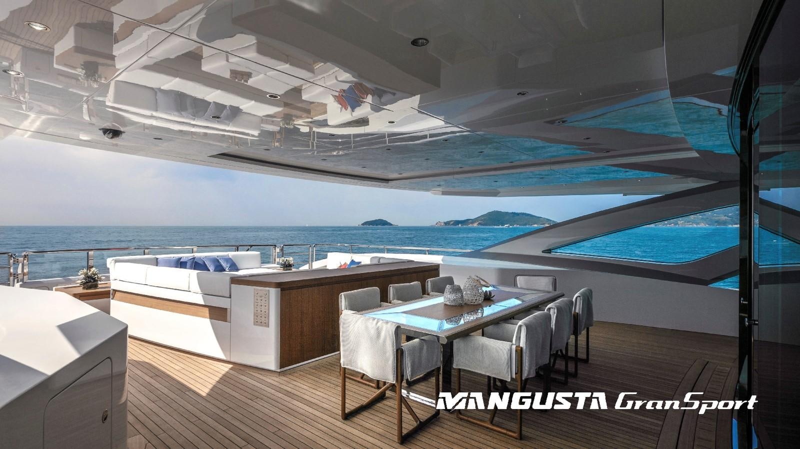 a room with a table and chairs aboard MANGUSTA 165REV/04 Yacht for Sale