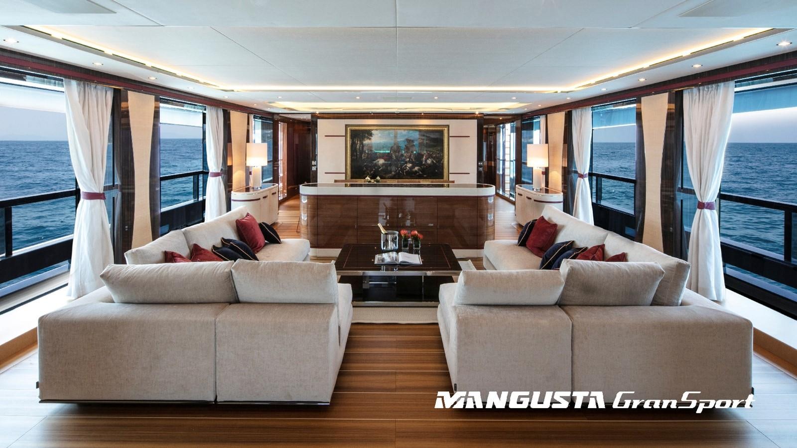 a living room with a large window aboard MANGUSTA 165REV/04 Yacht for Sale