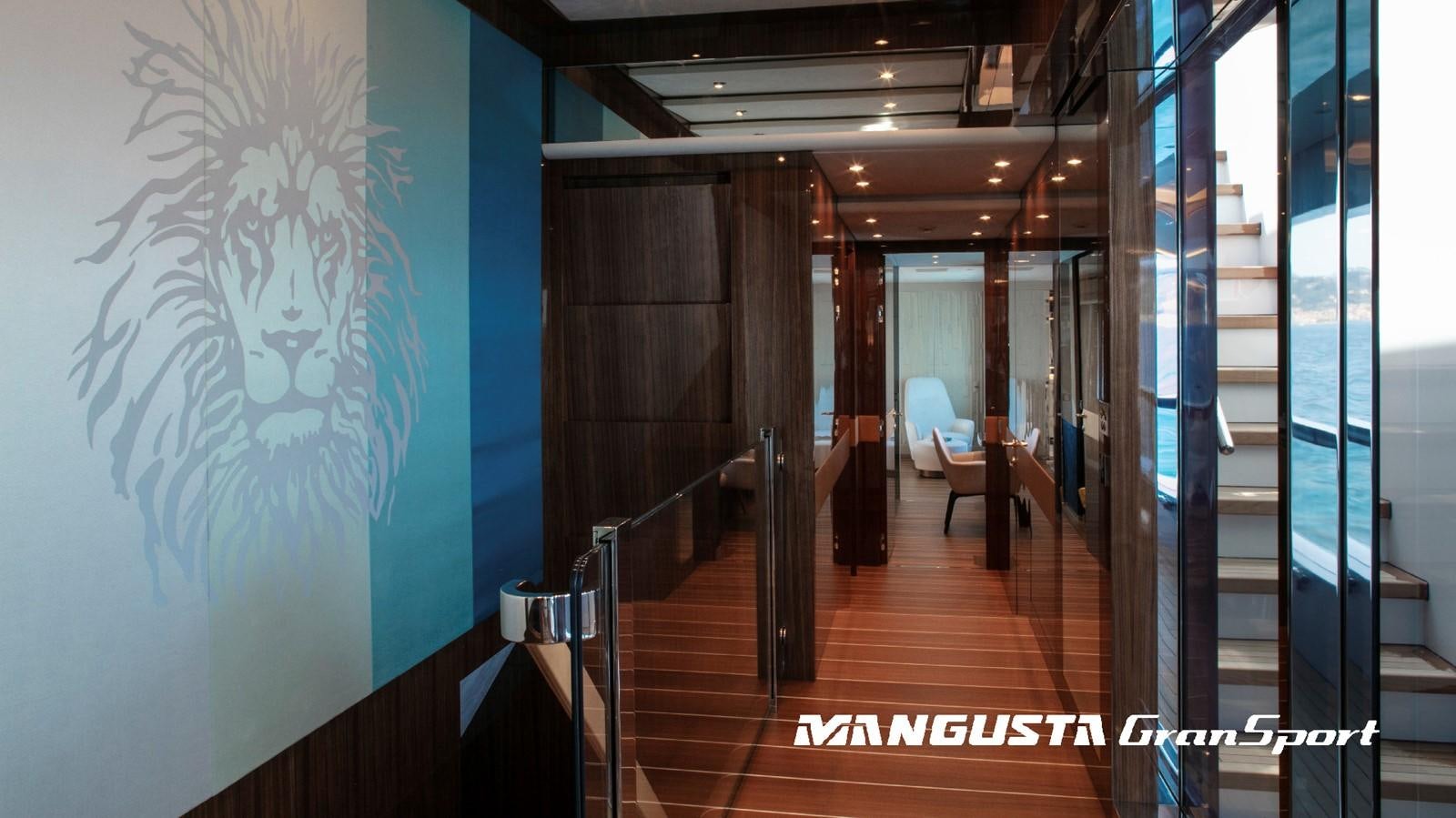 a hallway with a glass door aboard MANGUSTA 165REV/04 Yacht for Sale