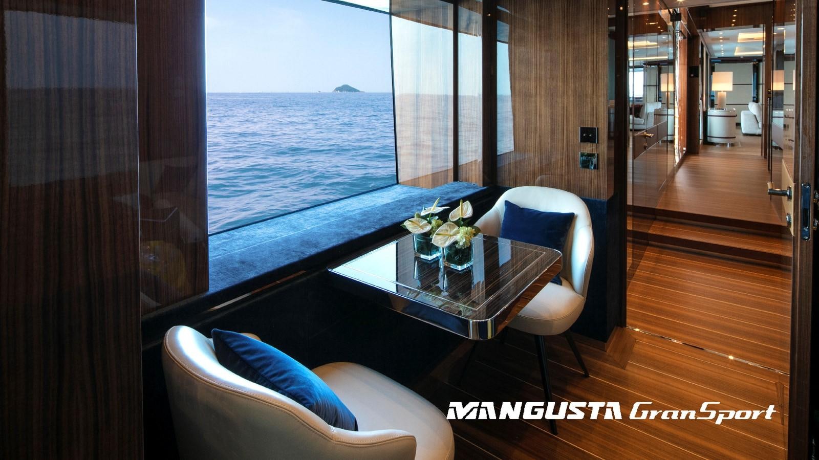 a room with a table and chairs aboard MANGUSTA 165REV/04 Yacht for Sale