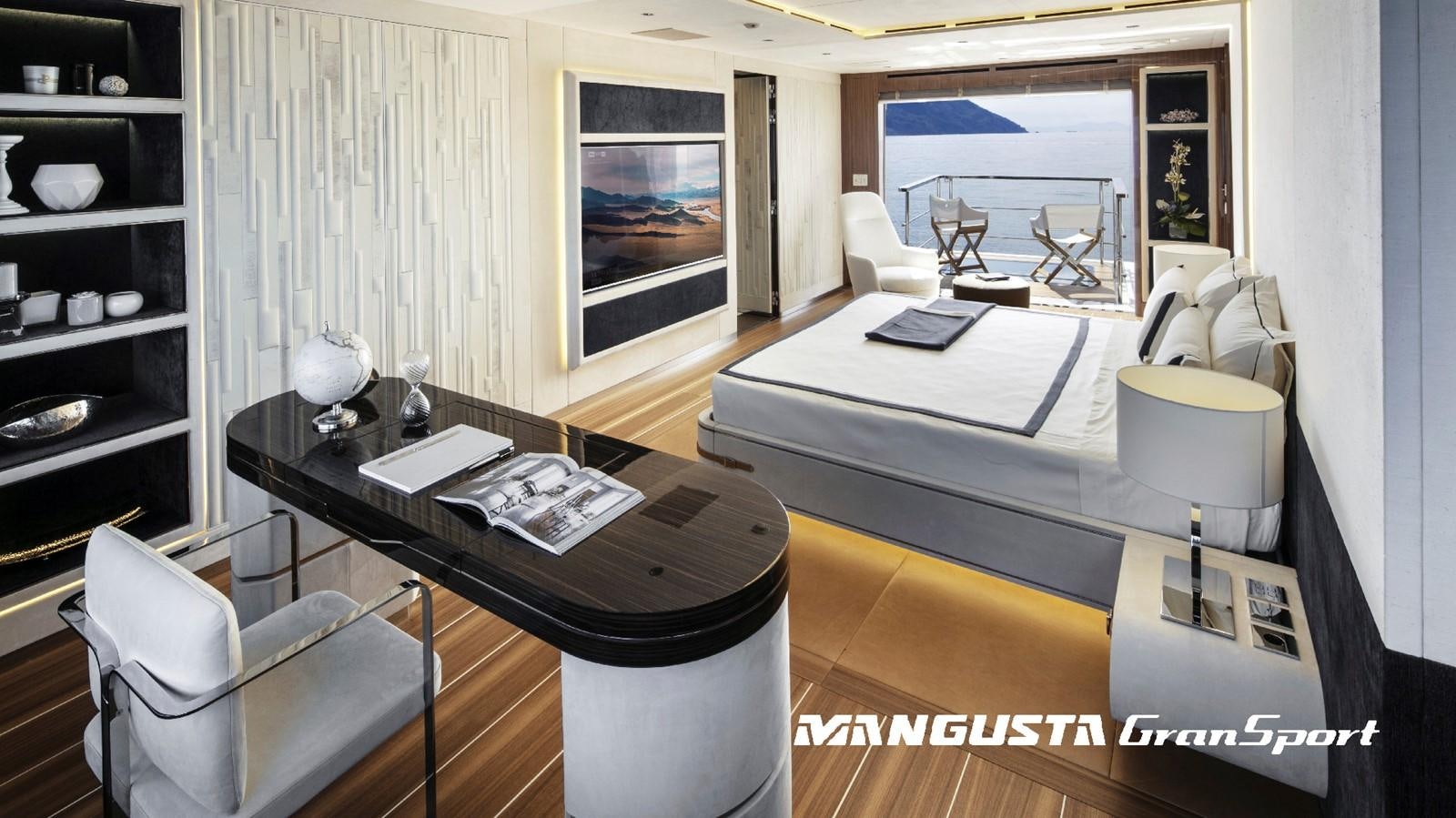 a room with a desk and a bed aboard MANGUSTA 165REV/04 Yacht for Sale