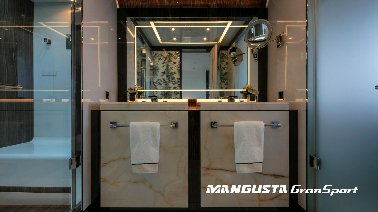 a bathroom with a sink and mirror aboard MANGUSTA 165REV/04 Yacht for Sale