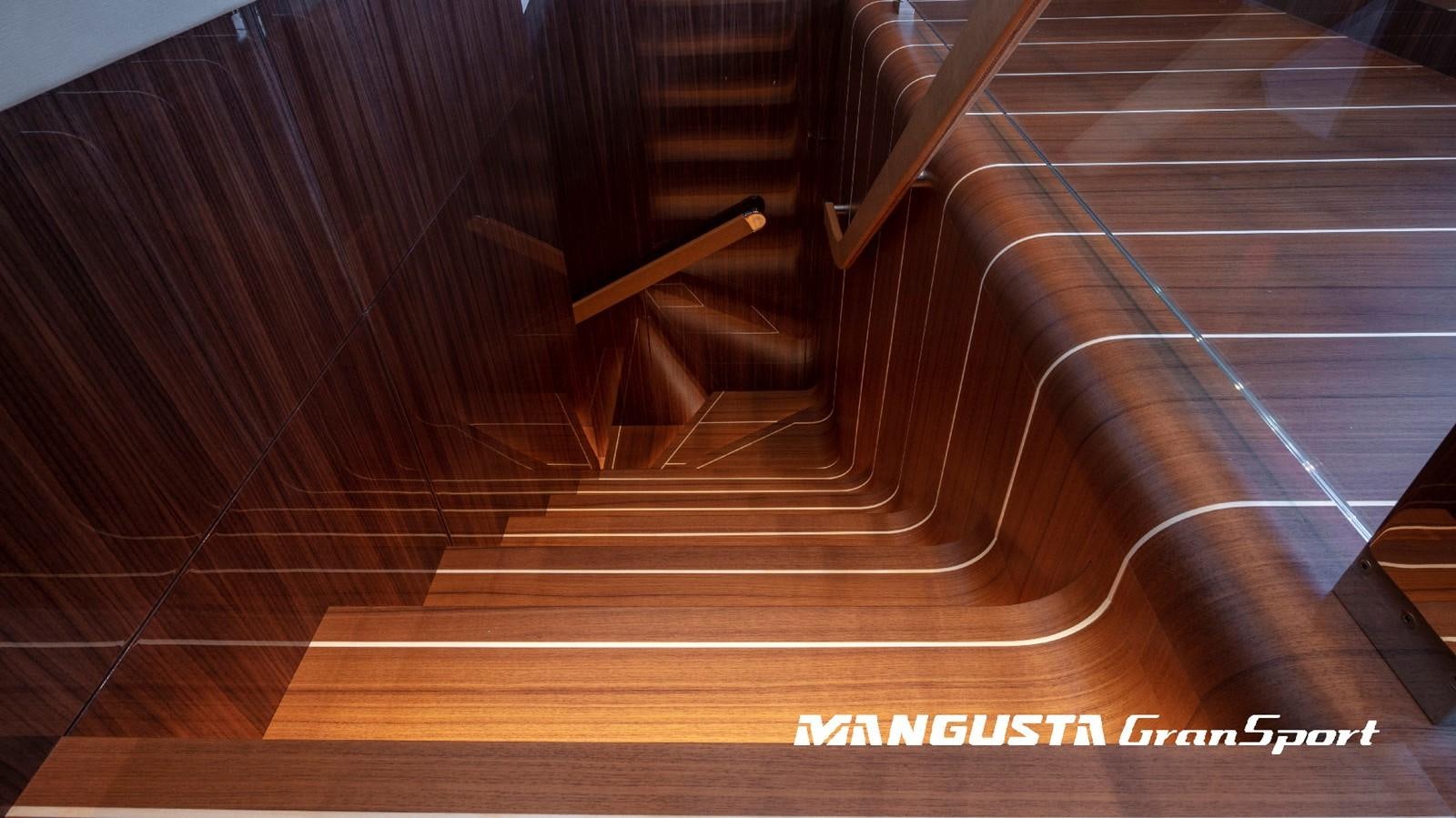 a wood floor with a wood railing aboard MANGUSTA 165REV/04 Yacht for Sale