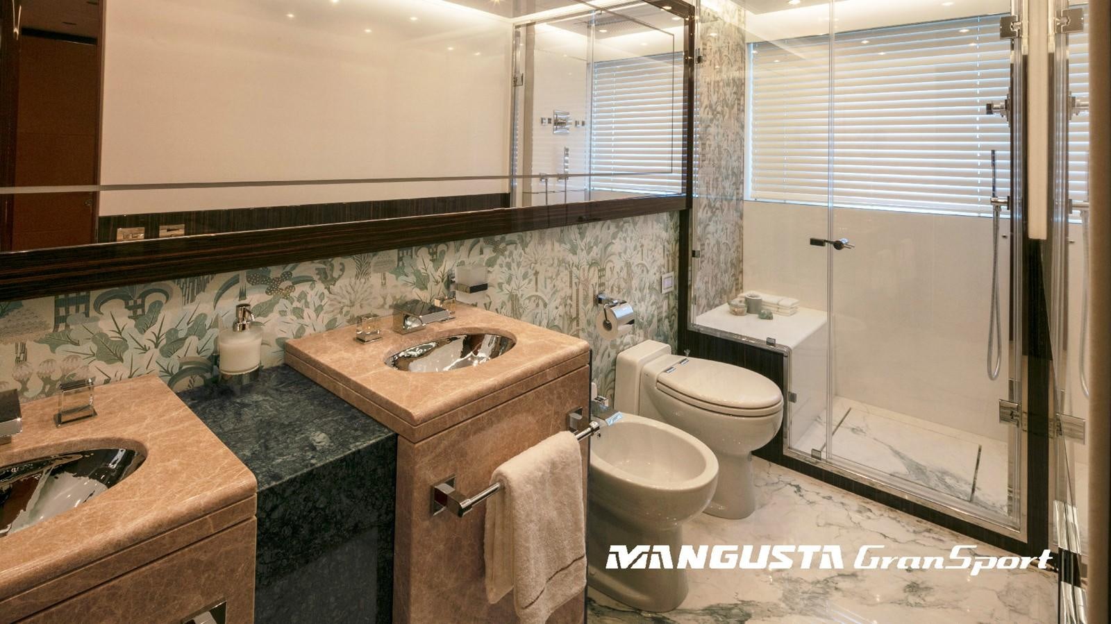 a bathroom with a sink toilet and a bathtub aboard MANGUSTA 165REV/04 Yacht for Sale