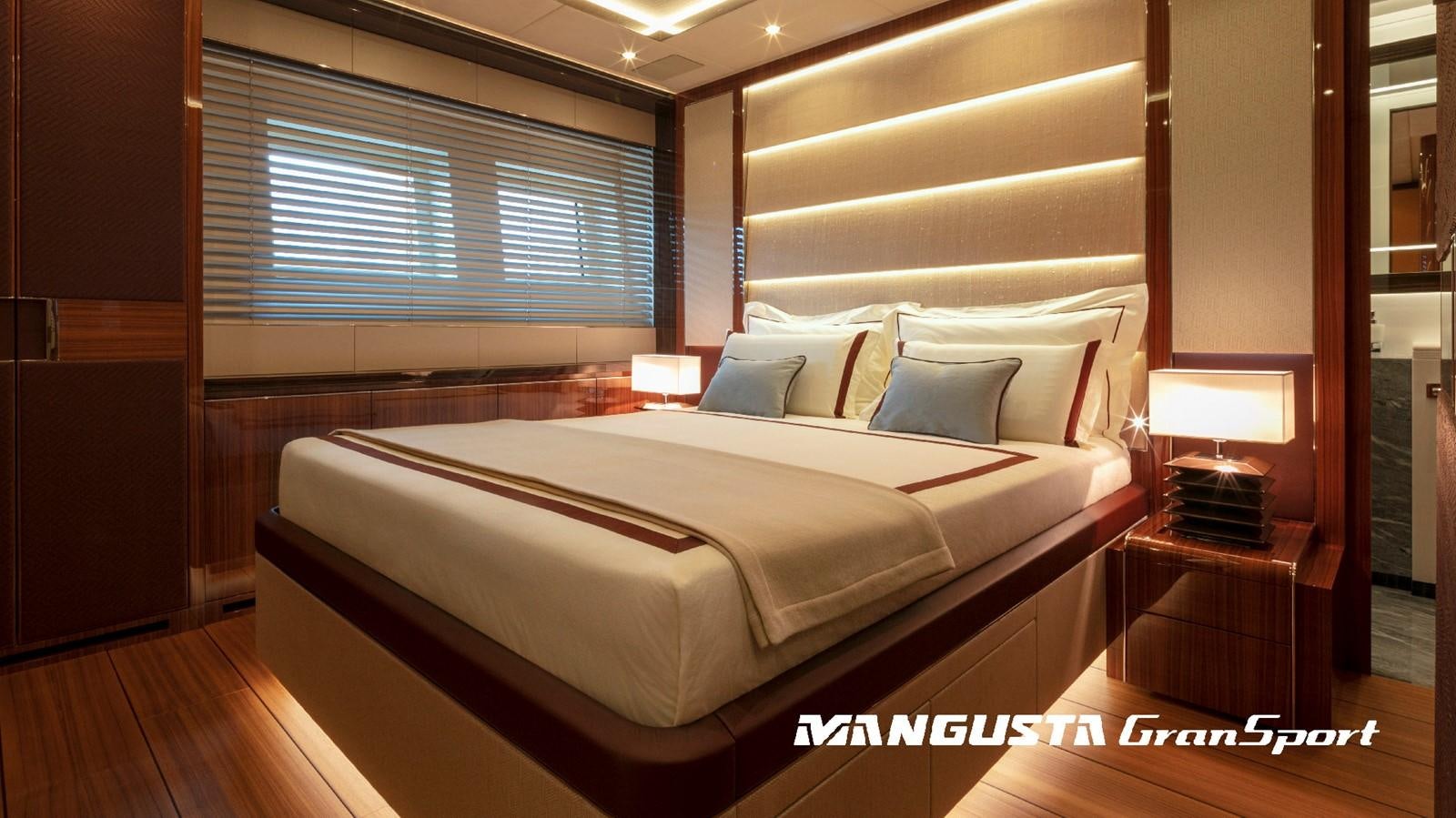a bed with a white sheet aboard MANGUSTA 165REV/04 Yacht for Sale
