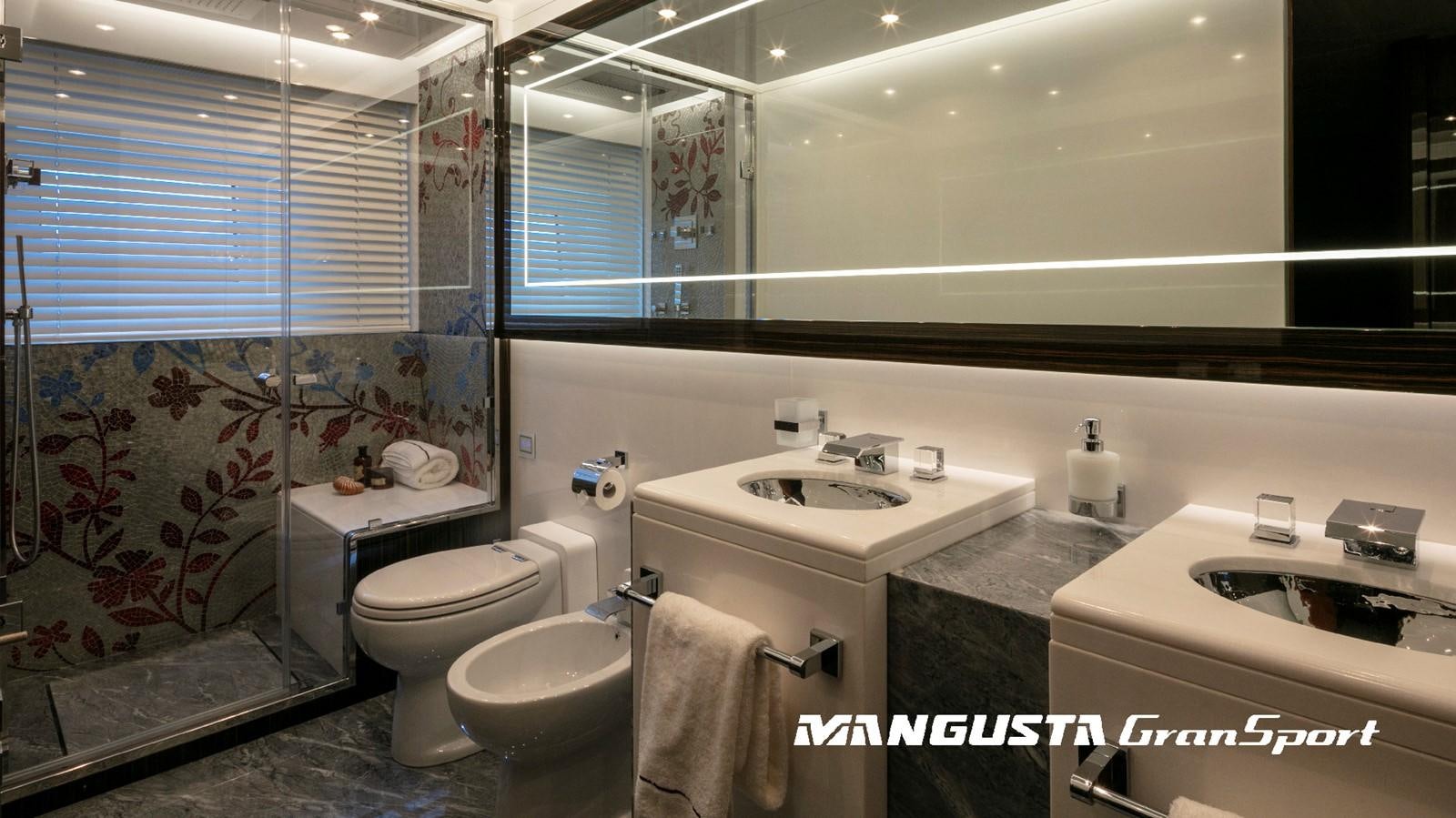 a bathroom with a large window aboard MANGUSTA 165REV/04 Yacht for Sale