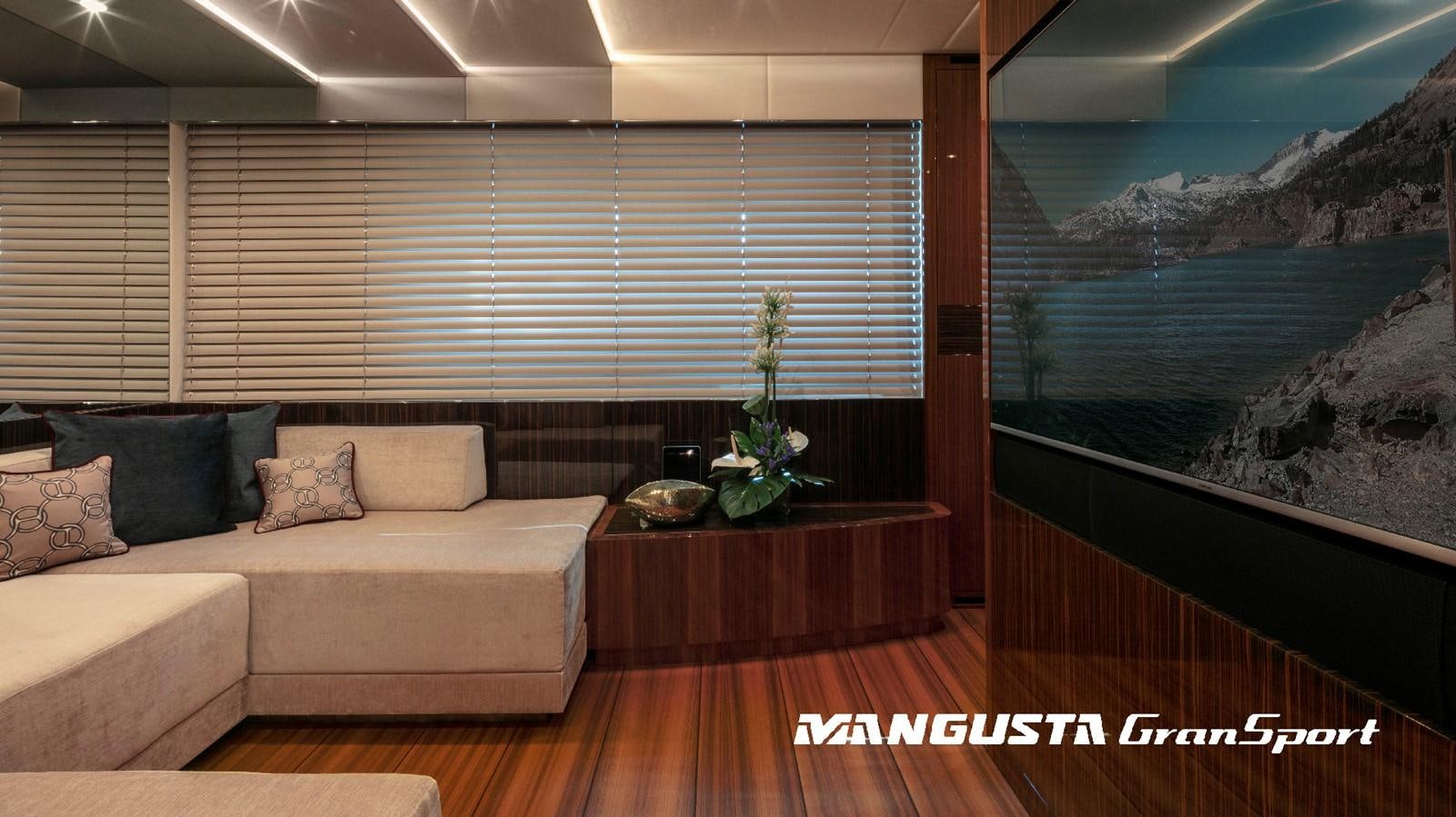 a room with a couch and a table aboard MANGUSTA 165REV/04 Yacht for Sale
