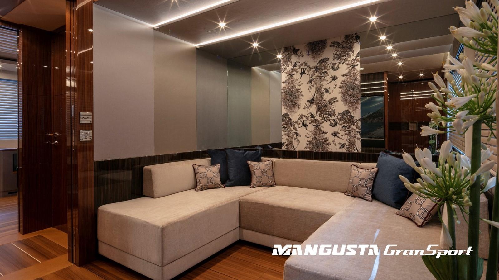 a couch in a room aboard MANGUSTA 165REV/04 Yacht for Sale