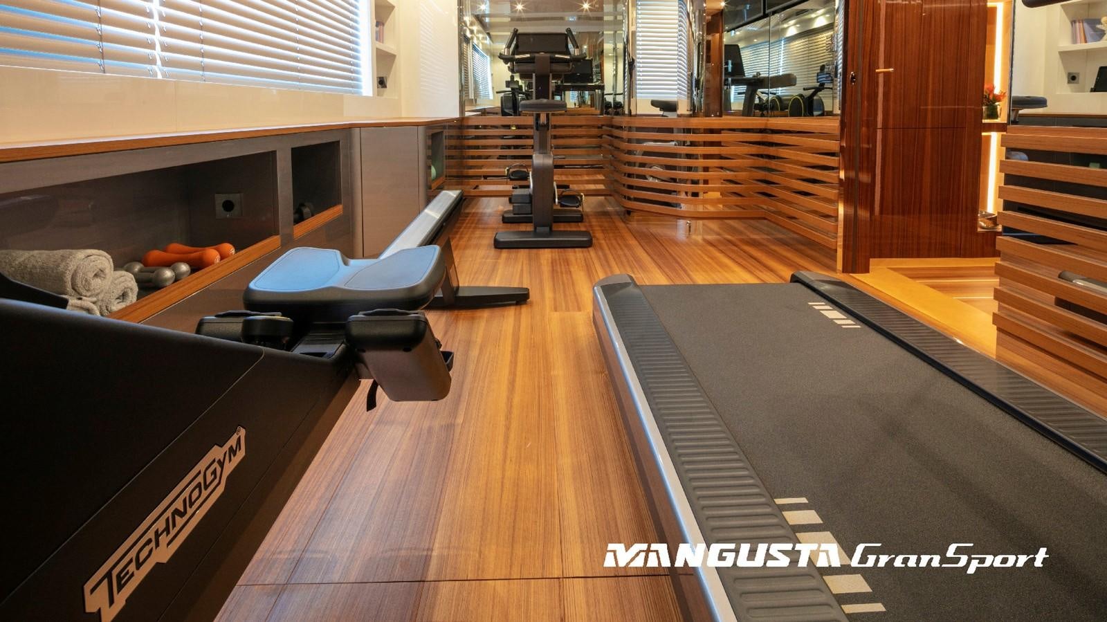 a room with a table and chairs aboard MANGUSTA 165REV/04 Yacht for Sale