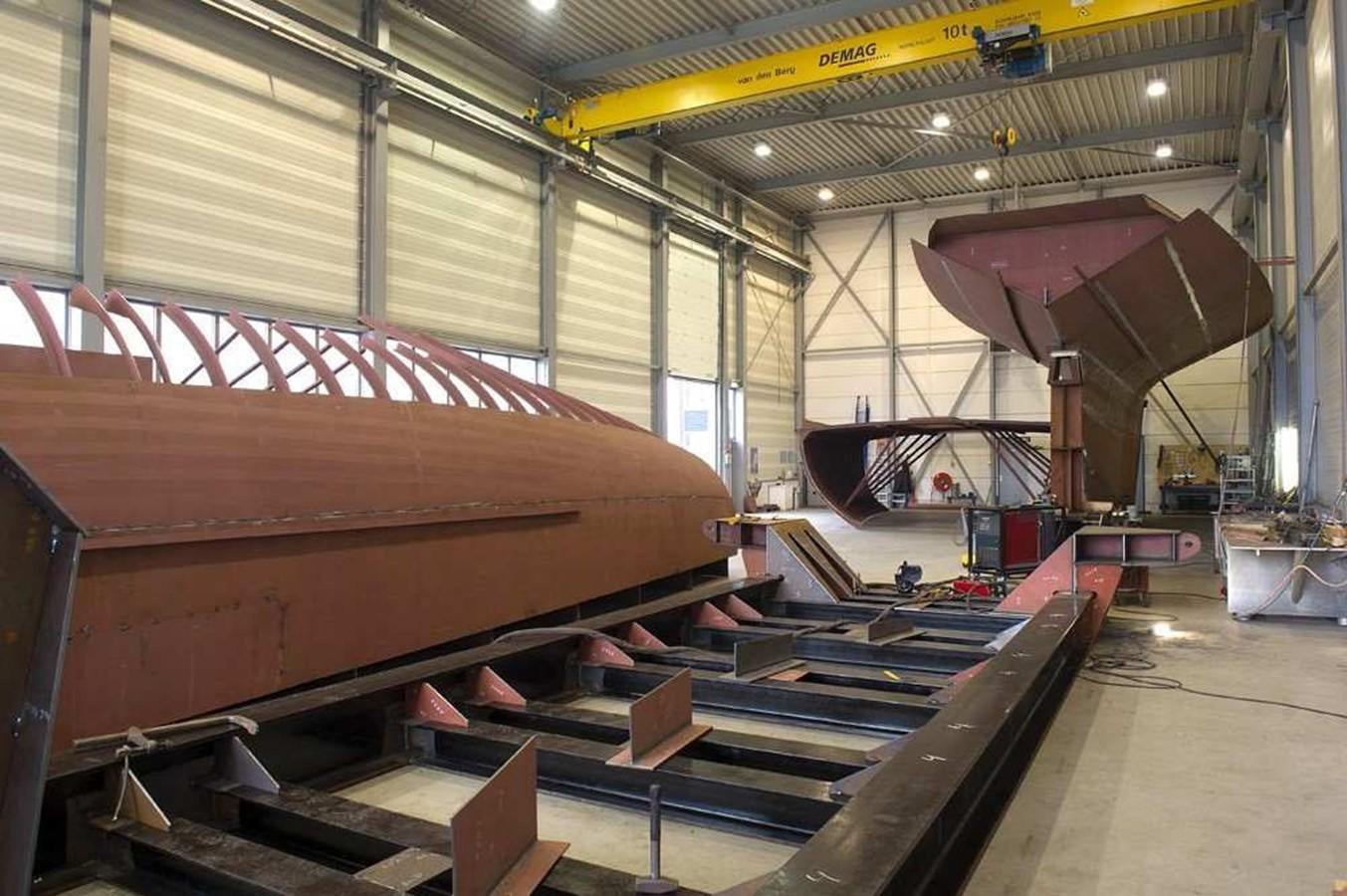 a large warehouse with a few large metal beams aboard INGOMAR Yacht for Sale