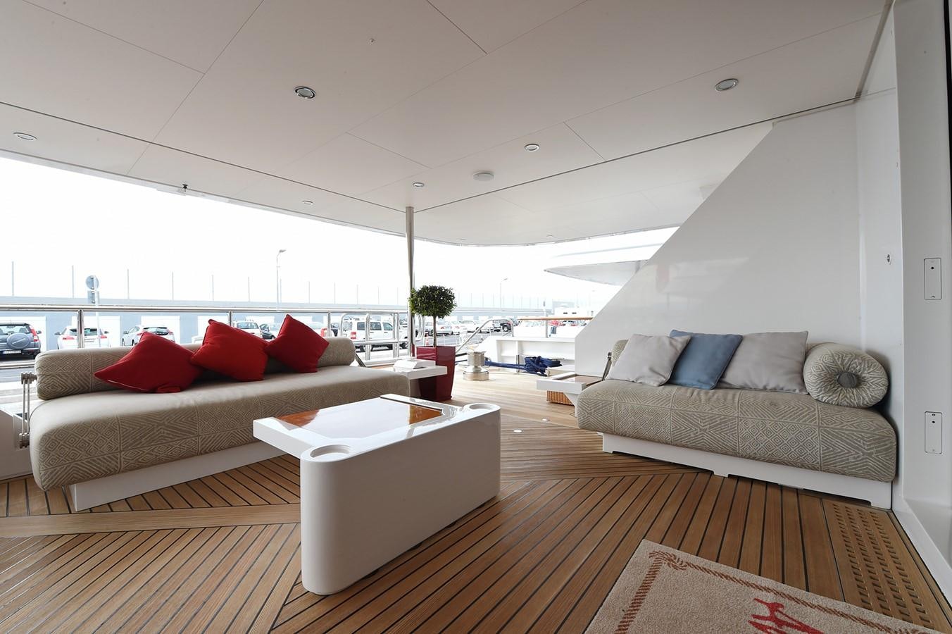 a living room with a couch and a table aboard AMORE MIO 2 Yacht for Sale