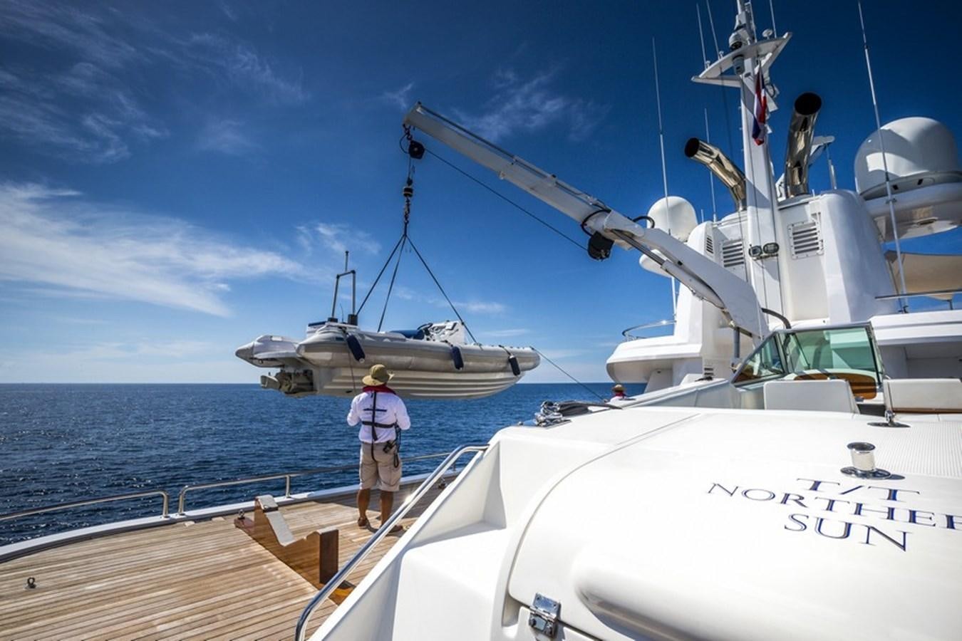 a person standing on a boat aboard NORTHERN SUN Yacht for Sale