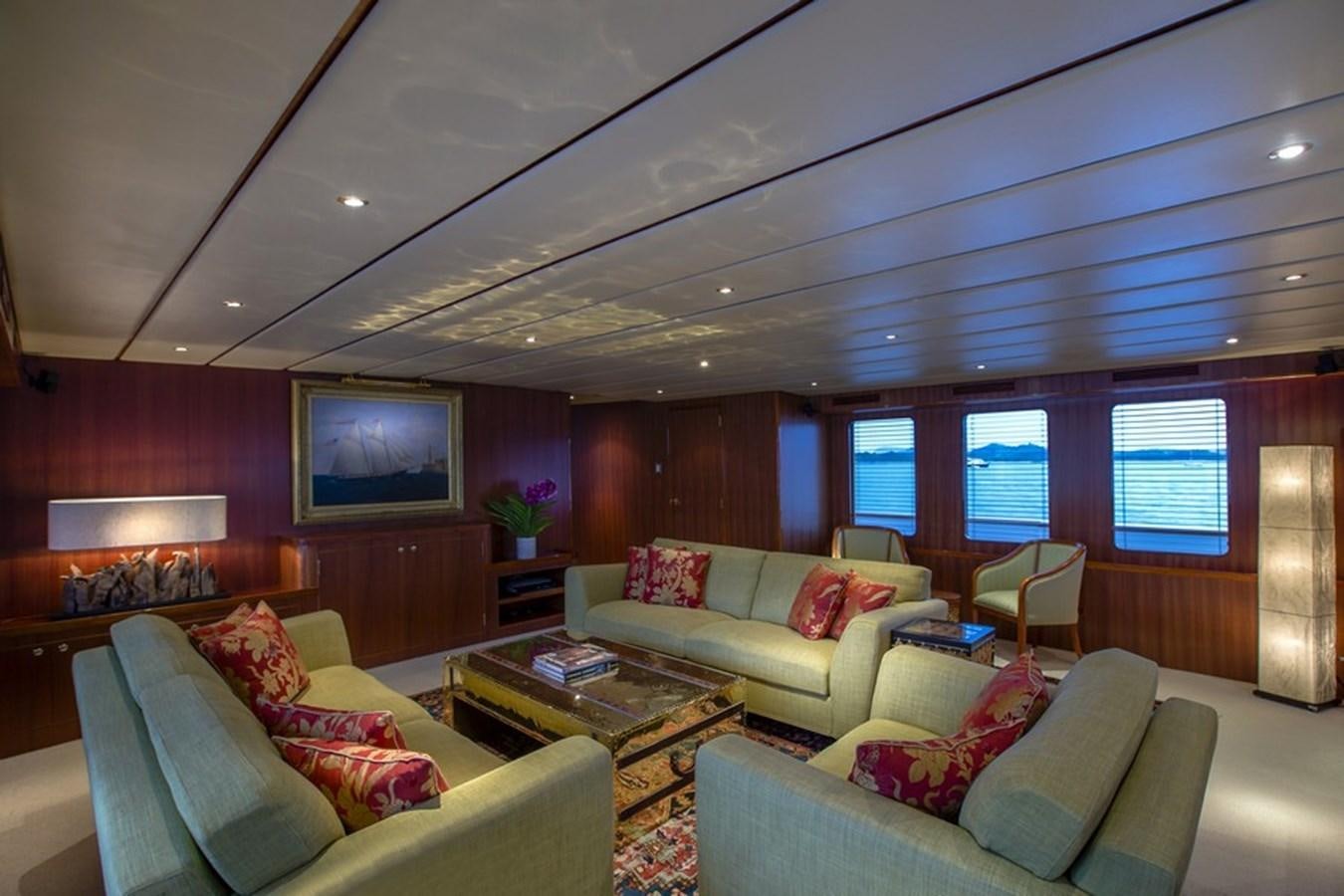 a living room with a couch and a coffee table aboard NORTHERN SUN Yacht for Sale